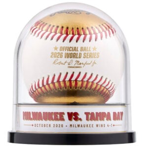Official 2026 gold dueling baseball in an Original Balldome display case with a Milwaukee vs. Tampa Bay series label